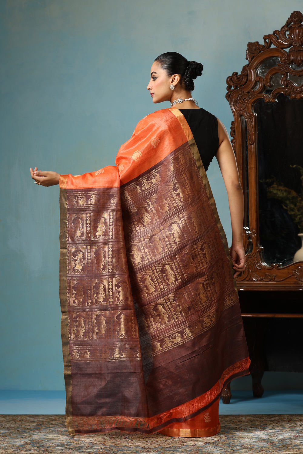 '-  Lily handmade vibrant orange Kosa Silk saree with intricate dancer motif design all over
