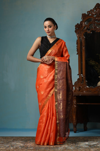 -  Lily handmade vibrant orange Kosa Silk saree with intricate dancer motif design all over