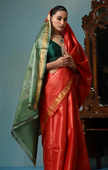 Jasmine handmade vibrant orange Kosa Silk saree with green palla and Chhattisgarhi folk dancer motifs