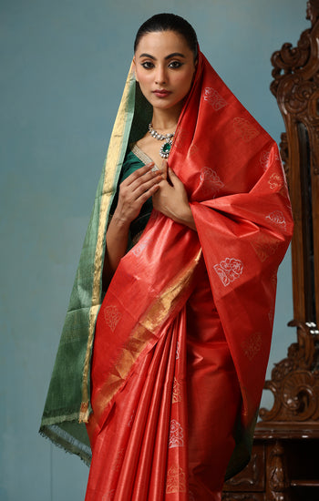 Jasmine handmade vibrant orange Kosa Silk saree with green palla and Chhattisgarhi folk dancer motifs