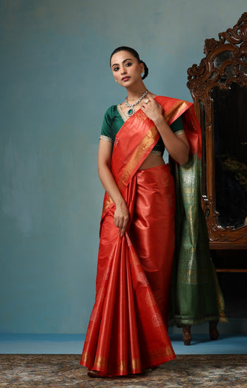 Jasmine handmade vibrant orange Kosa Silk saree with green palla and Chhattisgarhi folk dancer motifs