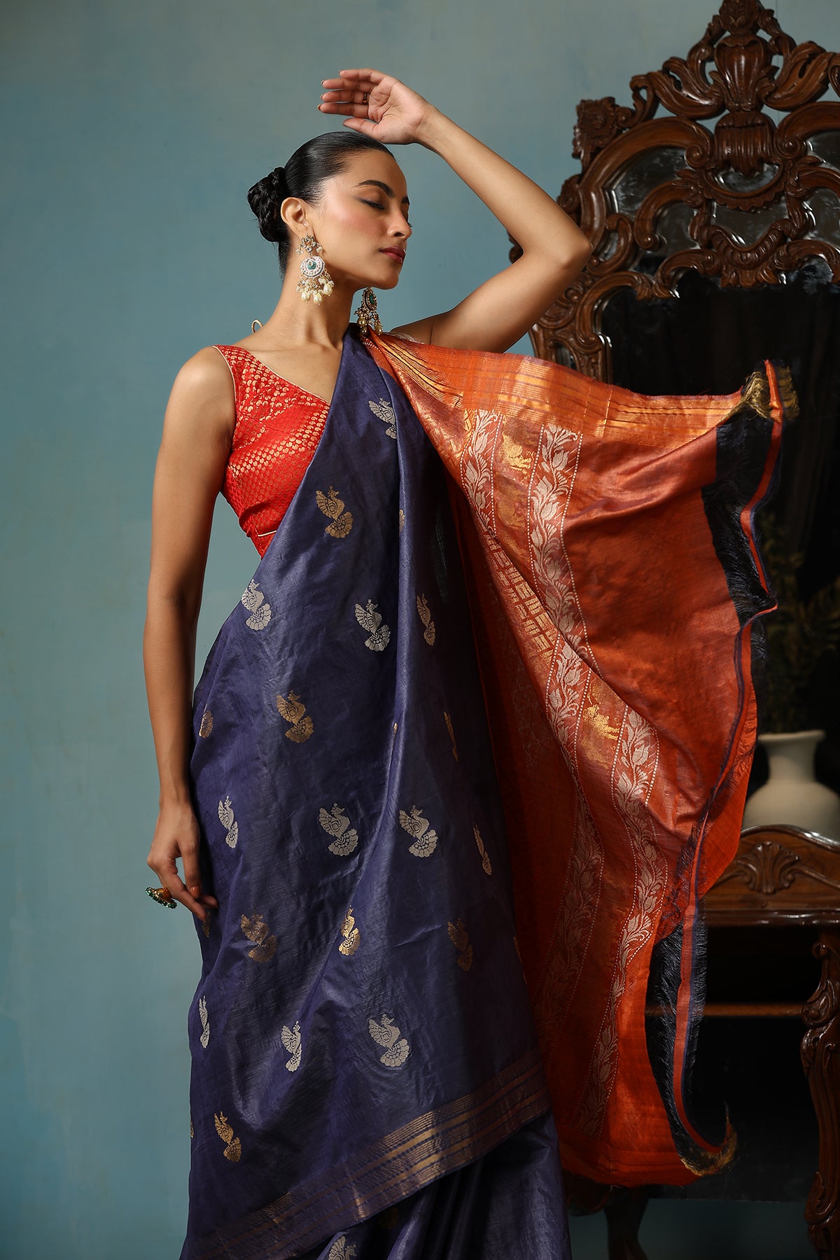 Azalea handmade navy blue Kosa Silk saree with bird motifs and red palla with lotus designs and cows