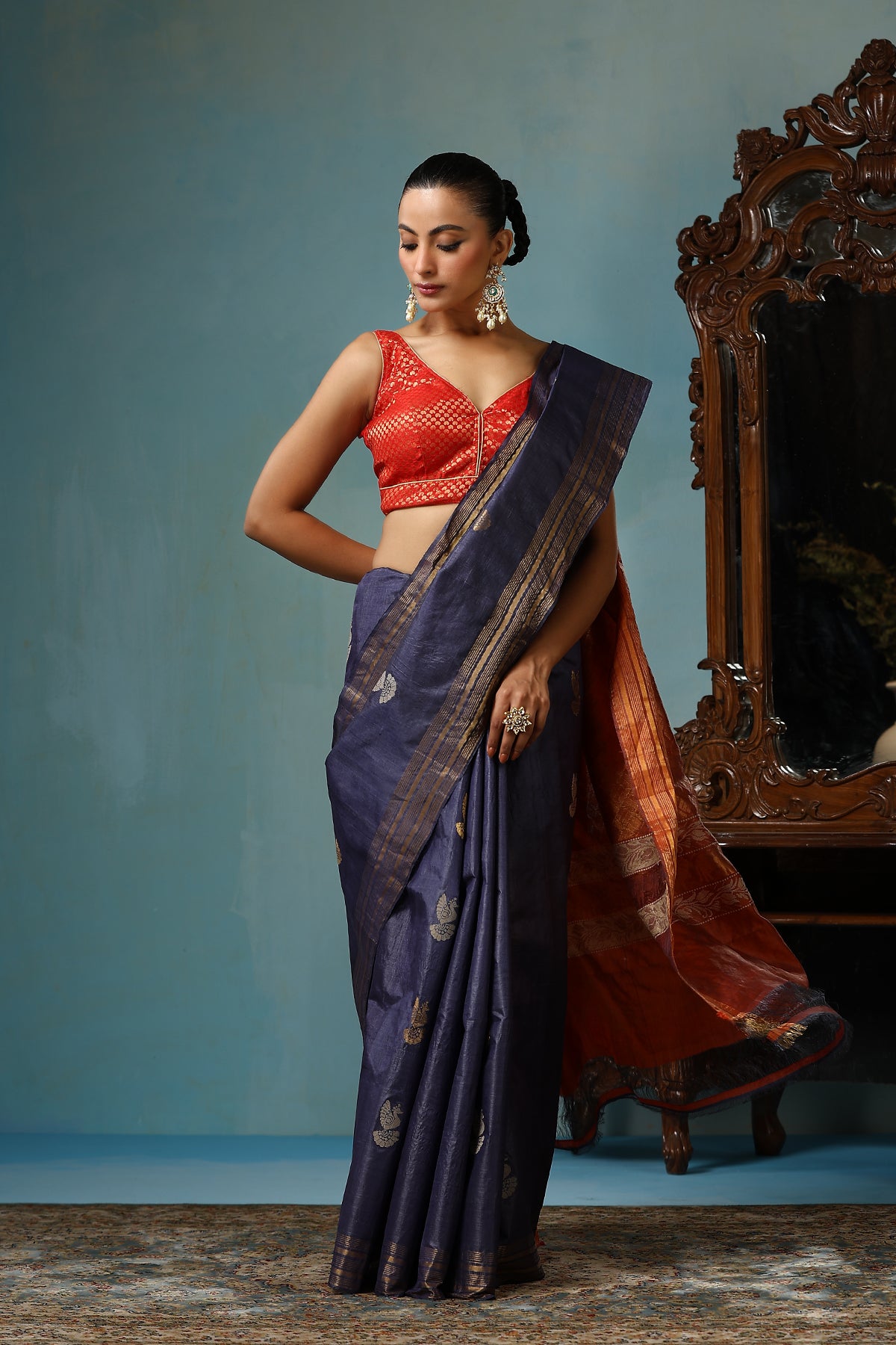 Azalea handmade navy blue Kosa Silk saree with bird motifs and red palla with lotus designs and cows