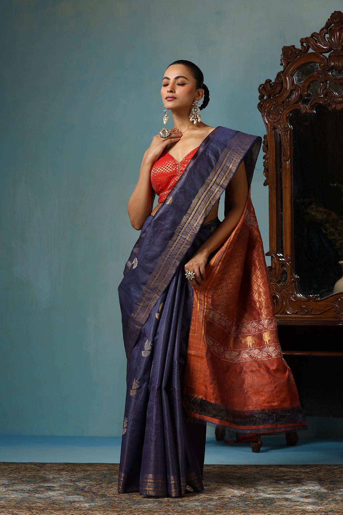 Azalea handmade navy blue Kosa Silk saree with bird motifs and red palla with lotus designs and cows