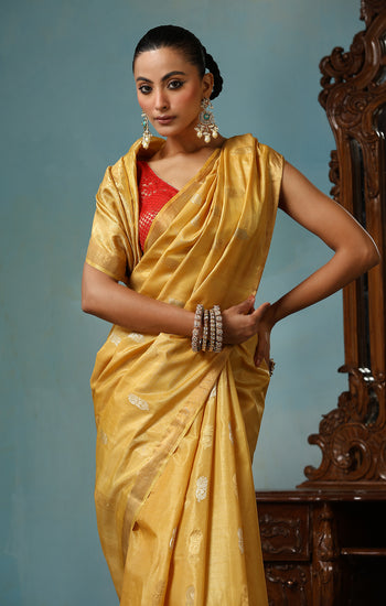 Marigold handmade light yellow-gold Kosa Silk saree with flower and leaf designs on the palla