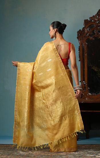 Marigold handmade light yellow-gold Kosa Silk saree with flower and leaf designs on the palla