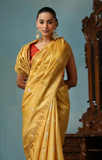 Marigold handmade light yellow-gold Kosa Silk saree with flower and leaf designs on the palla