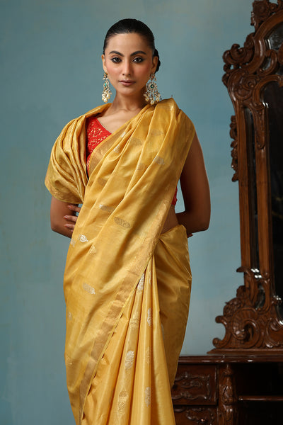 -  Marigold handmade light yellow-gold Kosa Silk saree with flower and leaf designs on the palla