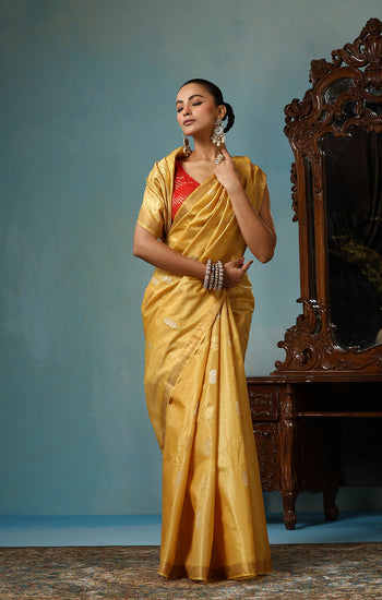 Marigold handmade light yellow-gold Kosa Silk saree with flower and leaf designs on the palla