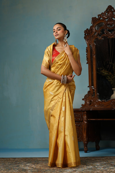 -  Marigold handmade light yellow-gold Kosa Silk saree with flower and leaf designs on the palla